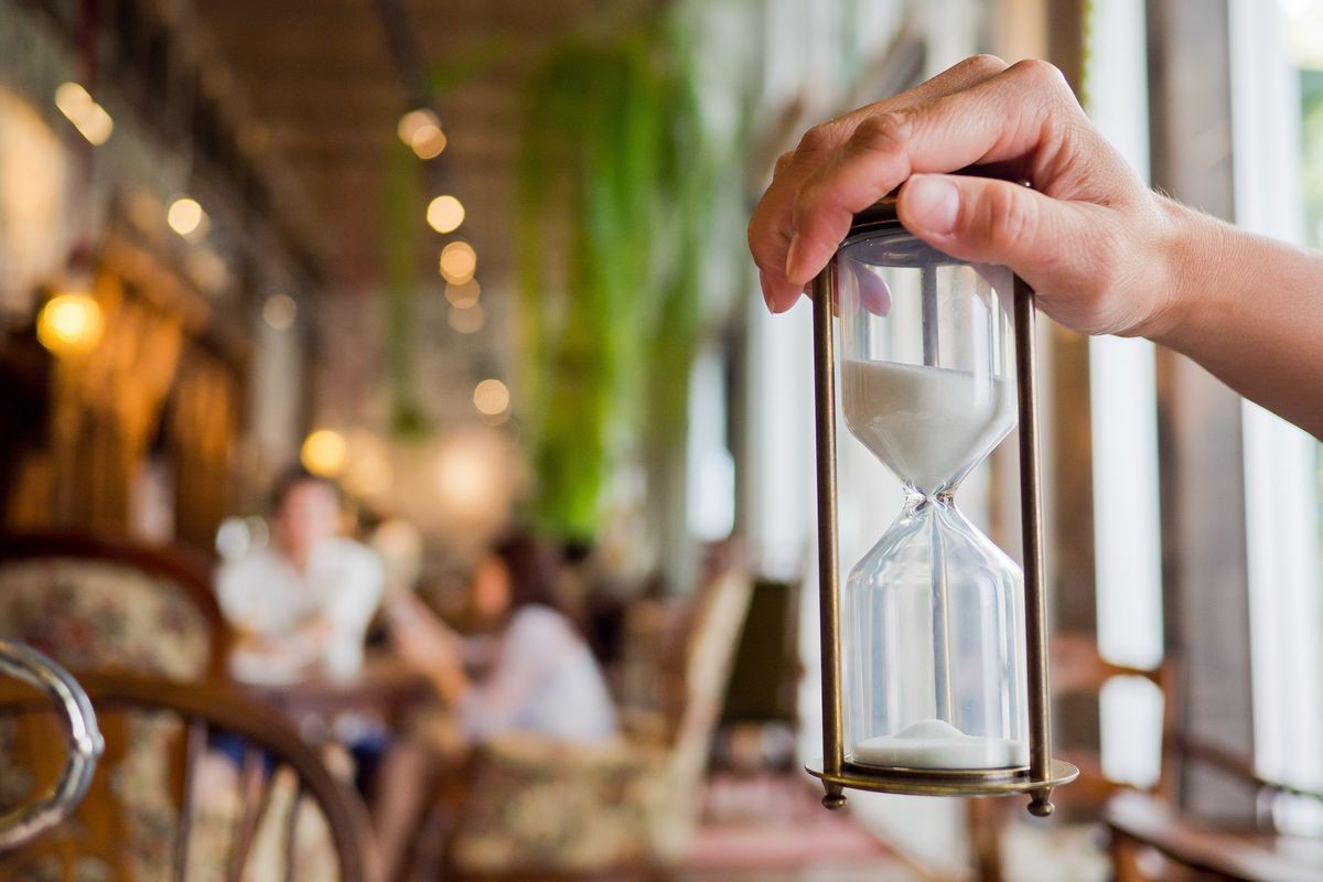 hourglass on hand, time countdown, clock with sand
